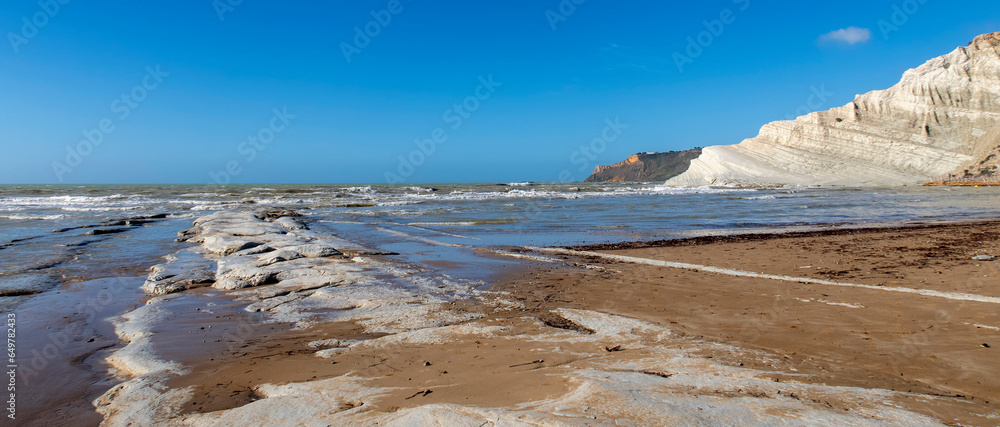 View of the limestone white cliffs with the beach at Stair of the Turks or Turkish Steps near Realmonte in Agrigento province. Sicily, Italy