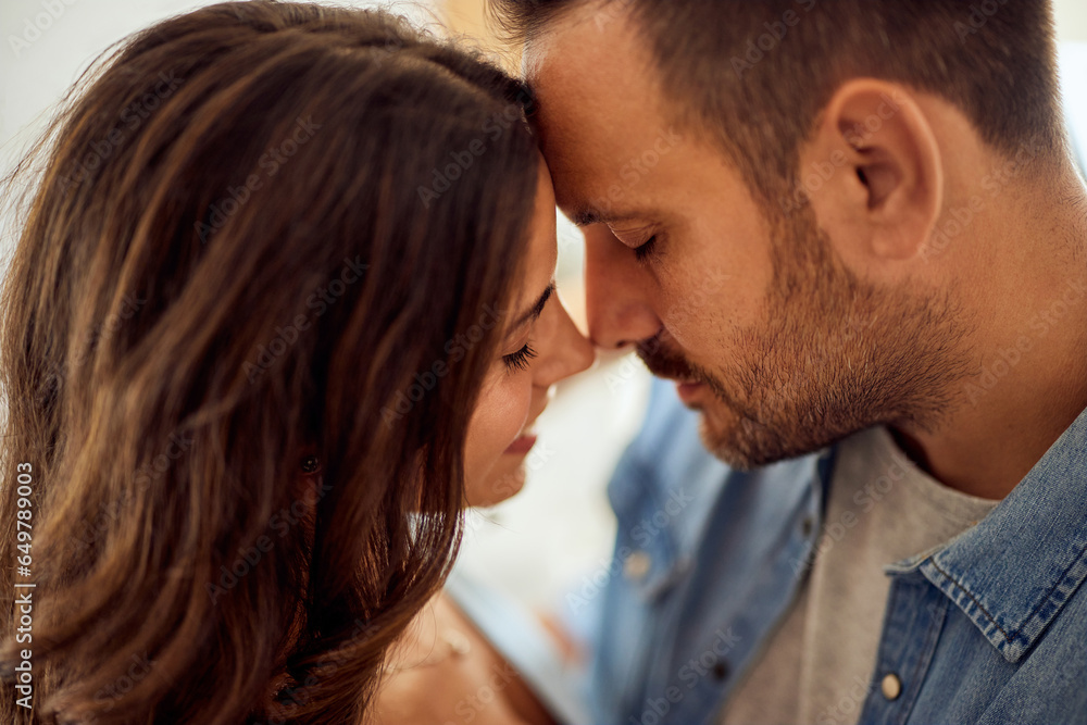 Close-up of two lovers, leaning for a kiss, sharing love, enjoying themselves together. Close-up of two lovers, leaning for a kiss, sharing love, enjoying themselves together.