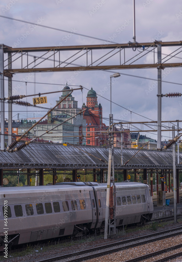 Rail way, trains and old apartment houses with domes at the channel Karlbergskanalen, an autumn day in Stockholm Rail way, trains and old apartment houses with domes at the channel Karlbergskanalen, an autumn day in Stockholm