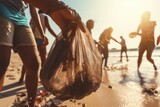 Volunteers group cleaning up beaches and coastal areas to protect marine ecosystems and wildlife. Ecologists activist during earth day for climate change