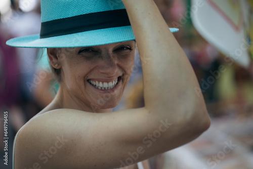 Young women, enjoying life. Big Smile, trying on a hat, holidays.