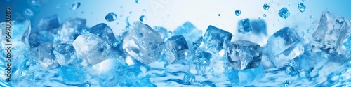 Pieces of ice and water on blue background. photo