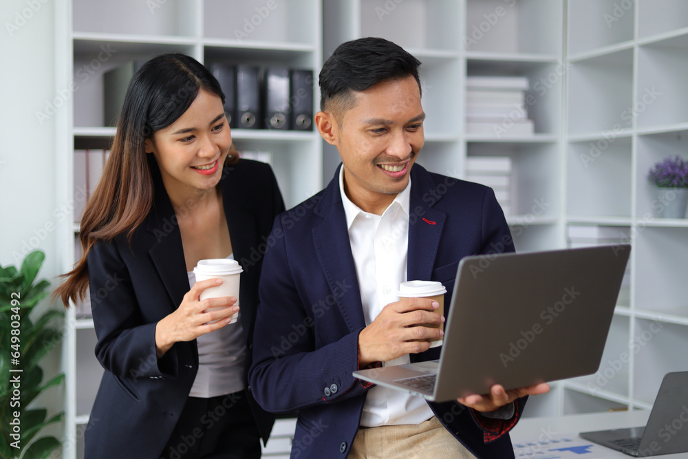 Boss and secretary working on documents together in office. Businessman and colleagues discussing in office collaboration. Boss and secretary working on documents together in office. Businessman and colleagues discussing in office collaboration.