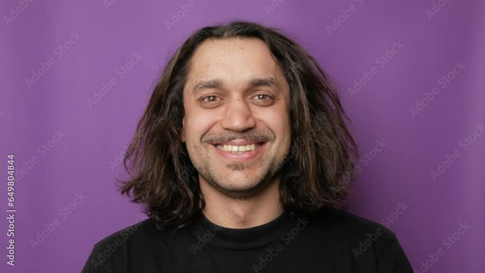 Closeup portrait of a young attractive guy, he is looking at the camera and smiling. Closeup portrait of a young attractive guy, he is looking at the camera and smiling.