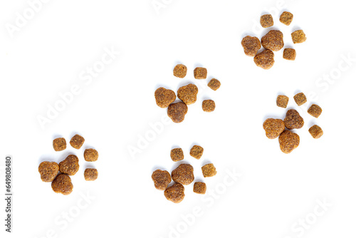 Traces of paws of a cat or dog are laid out from dry cat food. Love to the animals. Care, Love