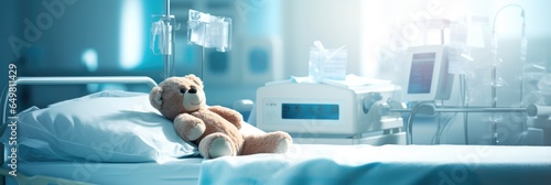 Banner with cute teddybear toy on patient bed at hospital. Health center or hospital room for young patient. Healthcare and childhood concept