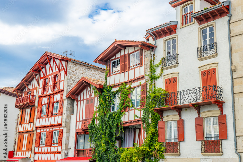Typical red and white basque houses in Ciboure, France Typical red and white basque houses in Ciboure, France