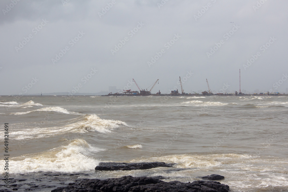 Rocky beach along the Arabian sea coast, Bandstand Promenade in Bandra, Mumbai. Rocky beach along the Arabian sea coast, Bandstand Promenade in Bandra, Mumbai.