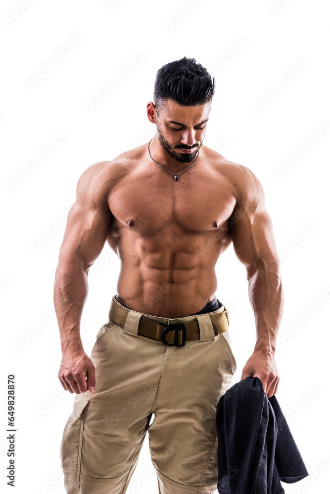 Fototapeta premium A shirtless man with no shirt holding a jacket, isolated on white in studio