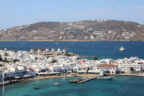 Mykonos, Greece - Looking over the town and the old harbor with its iconic windmills.