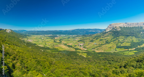 Scenic view of a green valley featuring small villages photo