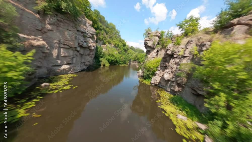 FPV, Ukrainian canyon in the village of Buki, Amazing aerial view of Buky canyon on a sunny day. Buka canyon on the Girsky Tikich river, Cherkasy region, Ukraine. Concept, travel, outdoor recreation, FPV, Ukrainian canyon in the village of Buki, Amazing aerial view of Buky canyon on a sunny day. Buka canyon on the Girsky Tikich river, Cherkasy region, Ukraine. Concept, travel, outdoor recreation,