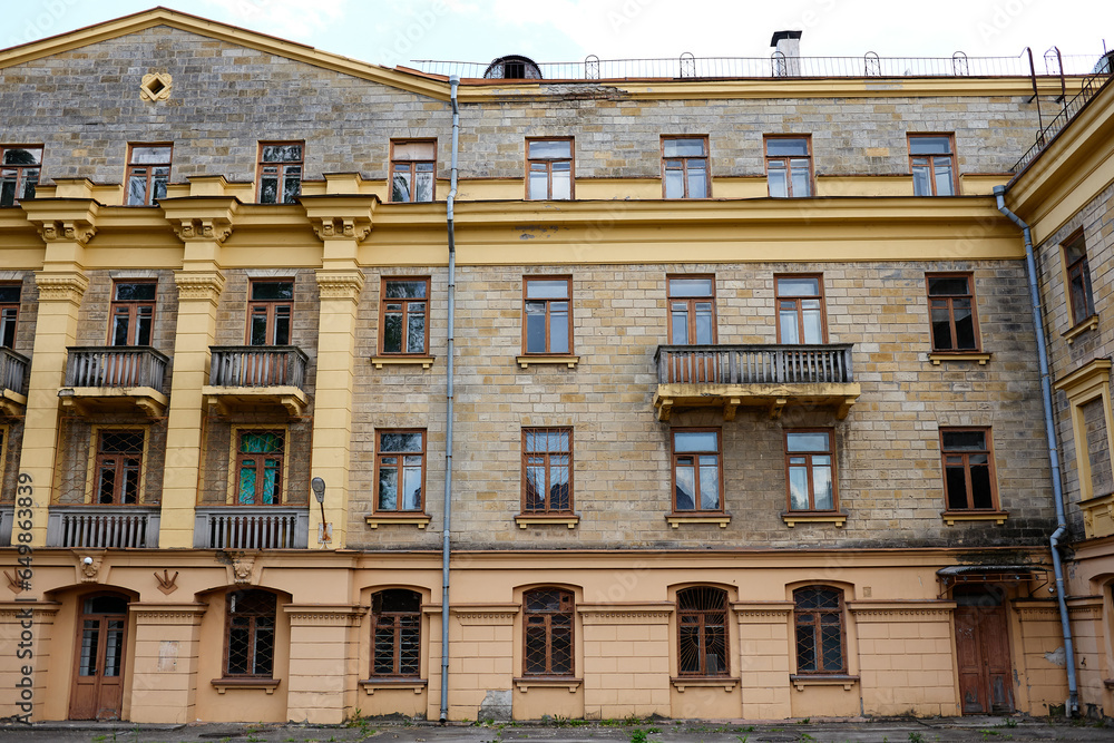 Naklejka premium View of the facade of typical soviet building, the construction of the 1950s in the style of Stalin Empire