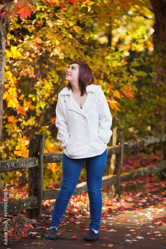 A Girl Walking Along A Trail In Autumn; Portland, Oregon, United States Of America