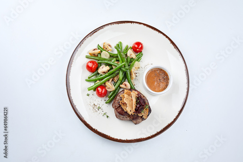 grilled steak with vegetables and sauce