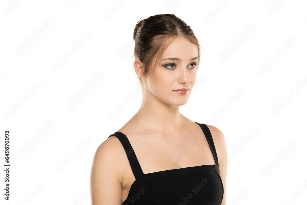 Elegant Beauty: Portrait of a Young Woman with Makeup and Updo on White Background Elegant Beauty: Portrait of a Young Woman with Makeup and Updo on White Background