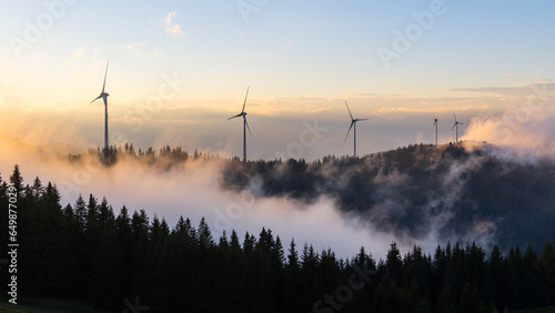 Dramatic weather condition around wind power plants at the Gaberl/Stubalpe mountain photo