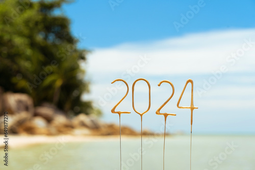 Numbers 2024 for the upcoming New Year on a tropical beach in bright sunny weather, concept of celebration in an exotic country