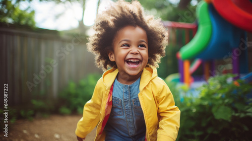 Portrait of joyful black child playing outdoor, Happy Childhood. International day for Tolerance.