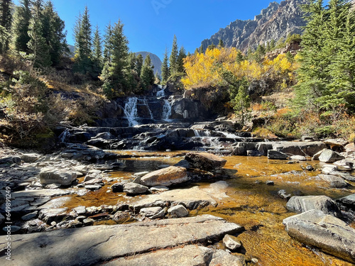 Waterfall and fall colors at Lundy Canyon, Eastern Sierra California, on a clear October day
