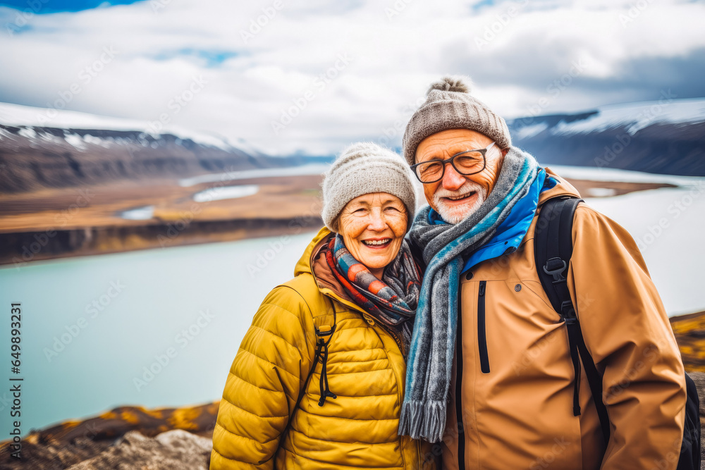 Multiethnic couple traveling in Iceland. Happy older travelers exploring in nature.