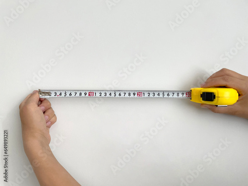 Women's hands hold a stretched roulette wheel on a white background.