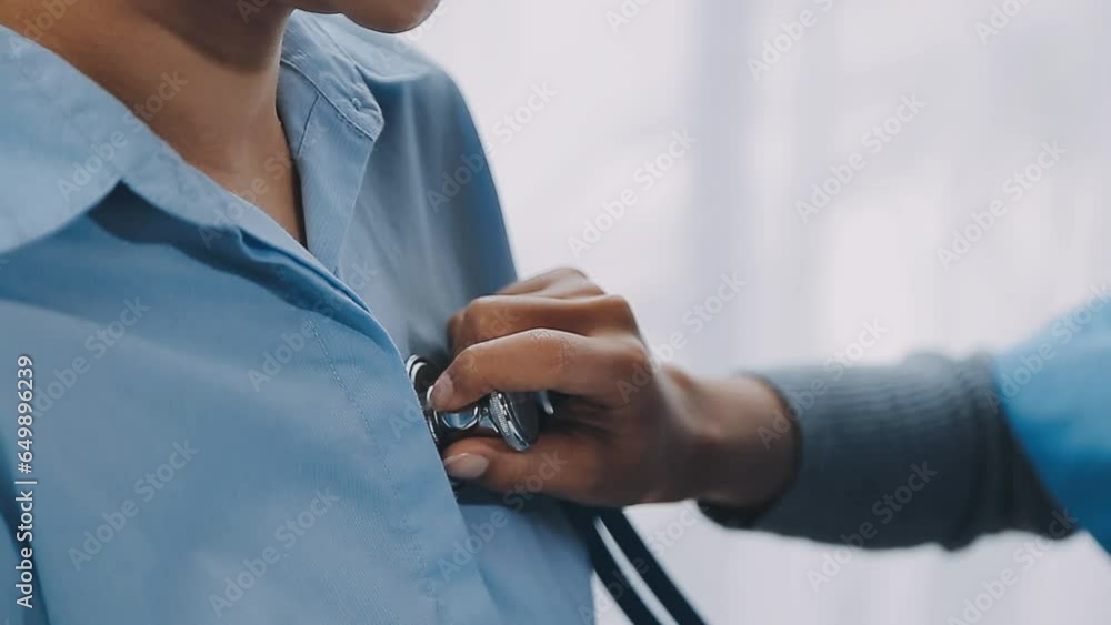 Woman patient visiting female doctor at clinic office. Medical work writes a prescription on a table in a hospital. Woman patient visiting female doctor at clinic office. Medical work writes a prescription on a table in a hospital.