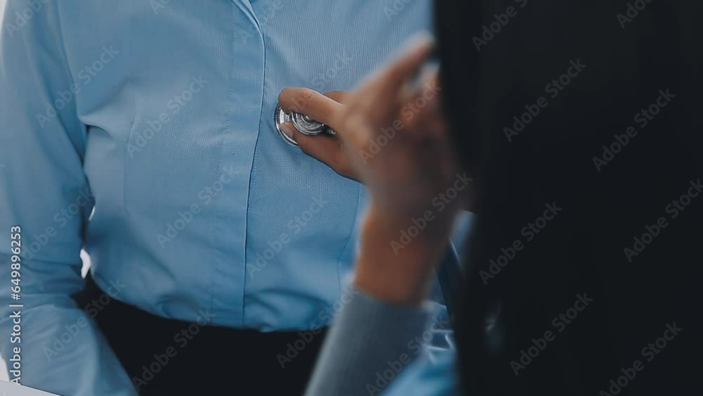 Woman patient visiting female doctor at clinic office. Medical work writes a prescription on a table in a hospital. Woman patient visiting female doctor at clinic office. Medical work writes a prescription on a table in a hospital.