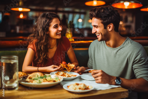 Young couple eating indian food at restaurant. Couple on date night with delicious food. Generative AI