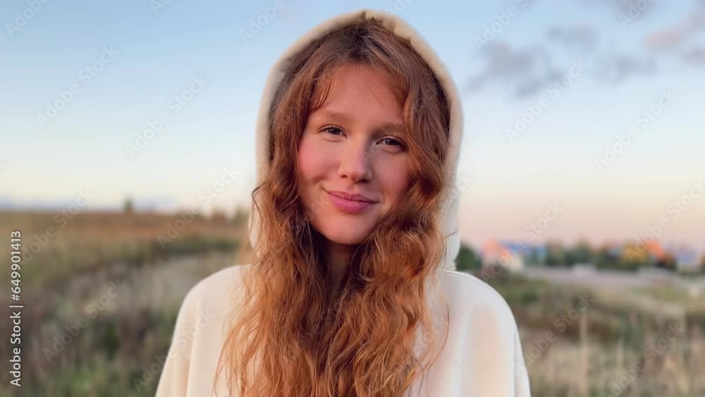 young cute woman dreaming and praying outdoors at sunset or sunrise in the park young cute woman dreaming and praying outdoors at sunset or sunrise in the park