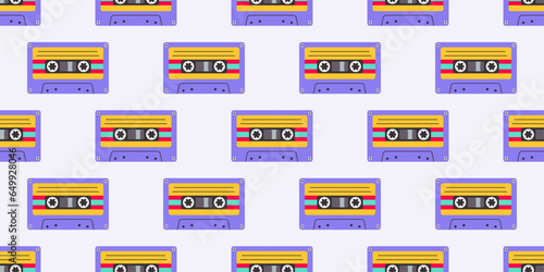 Retro seamless pattern with audio cassettes. Vector background. Purple colors. Trendy cartoon style in 80 90s.