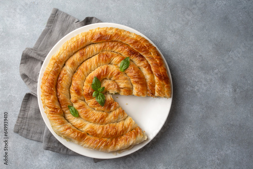 Turkish Tepsi Boregi, Round Borek, Tray pastry (Turkish name; rulo borek - ispanakli borek) photo