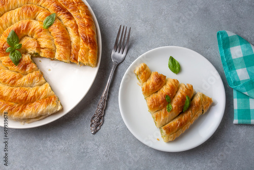 Turkish Tepsi Boregi, Round Borek, Tray pastry (Turkish name; rulo borek - ispanakli borek) photo