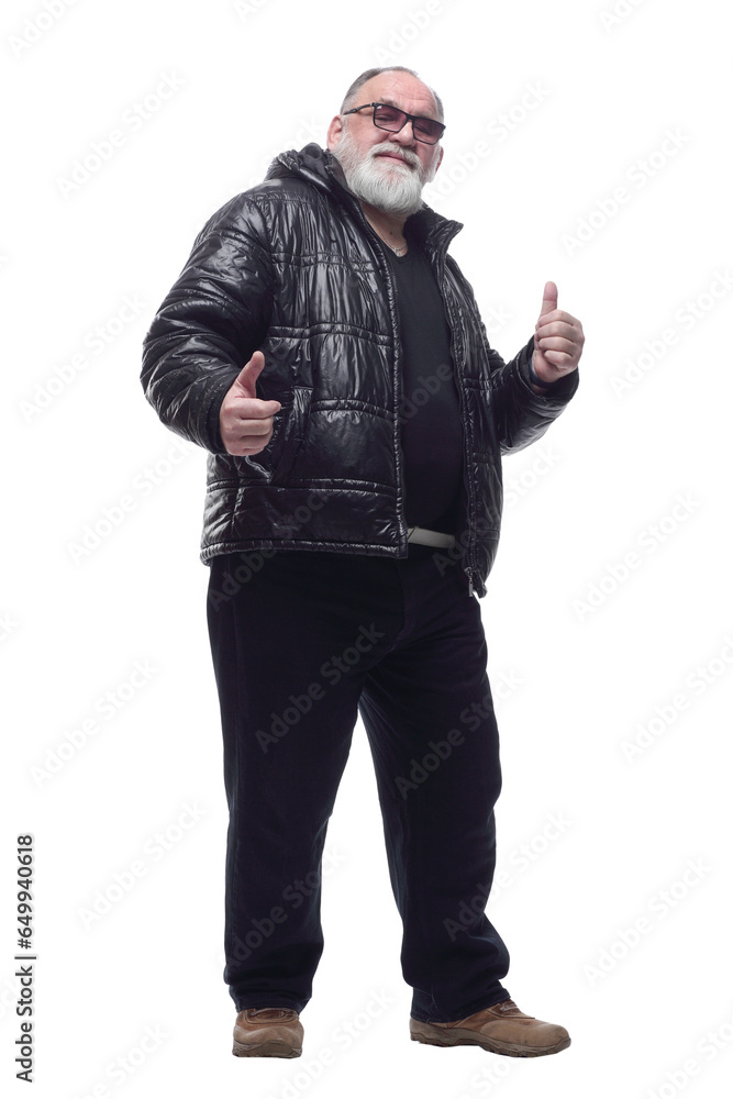 contented bearded man in a winter jacket giving a thumbs up. contented bearded man in a winter jacket giving a thumbs up.