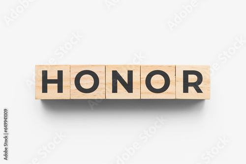 Honor wooden cubes on grey background