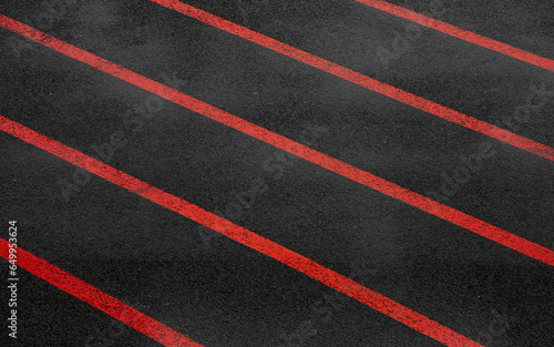 Orange paralel lines on dark wet asphalt