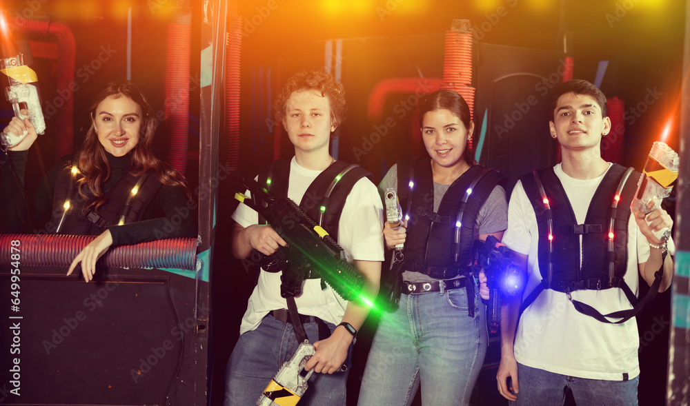 Triumphing team of laser tag winners guys and girls