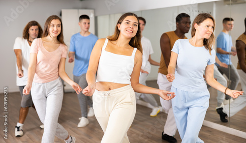Dance class for adult people, positive women and men training in studio