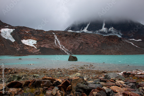 A glacier lake near Unna Raitastugan Mountain Cabin, Lapland, Sweden photo