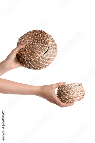 Female hands holding wicker...