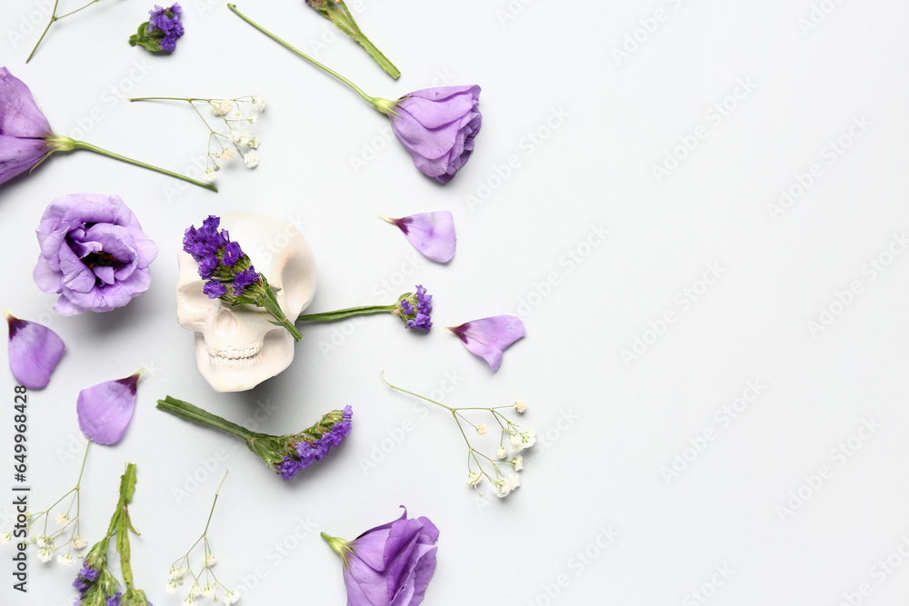 Composition with human skull and beautiful flowers on white background Composition with human skull and beautiful flowers on white background
