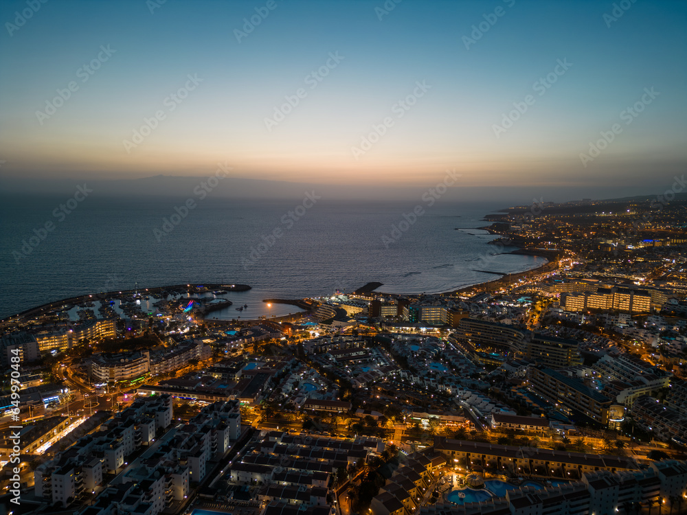 aerial view of illuminated light night city with ocean shore, Tenerife, Canary