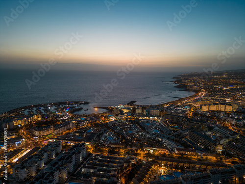 aerial view of illuminated light night city with ocean shore  Tenerife  Canary