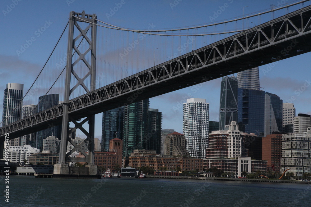 View from water of the San Francisco Bay Bridge in front of the Embarcadero and SF skyline on a clear day