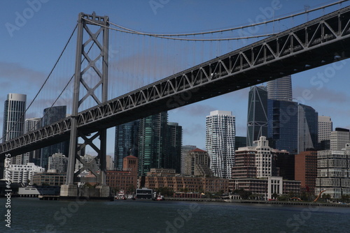 View from water of the San Francisco Bay Bridge in front of the Embarcadero and SF skyline on a clear day
