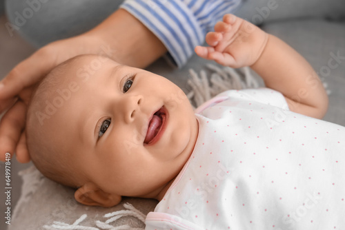 Happy infant baby lying on ...
