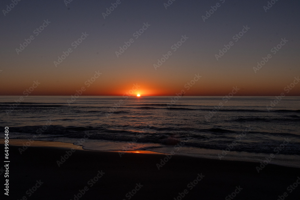 Sunrise over the Atlantic Ocean from the beach on Pawleys Island South Carolina