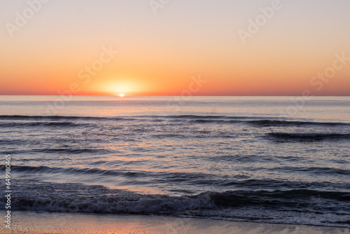 Sunrise over the Atlantic Ocean from the beach on Pawleys Island South Carolina © John McAdorey