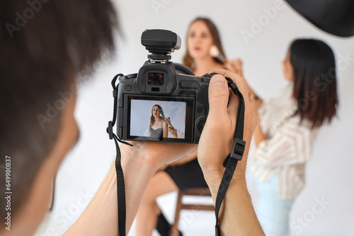 Male photographer and his a...