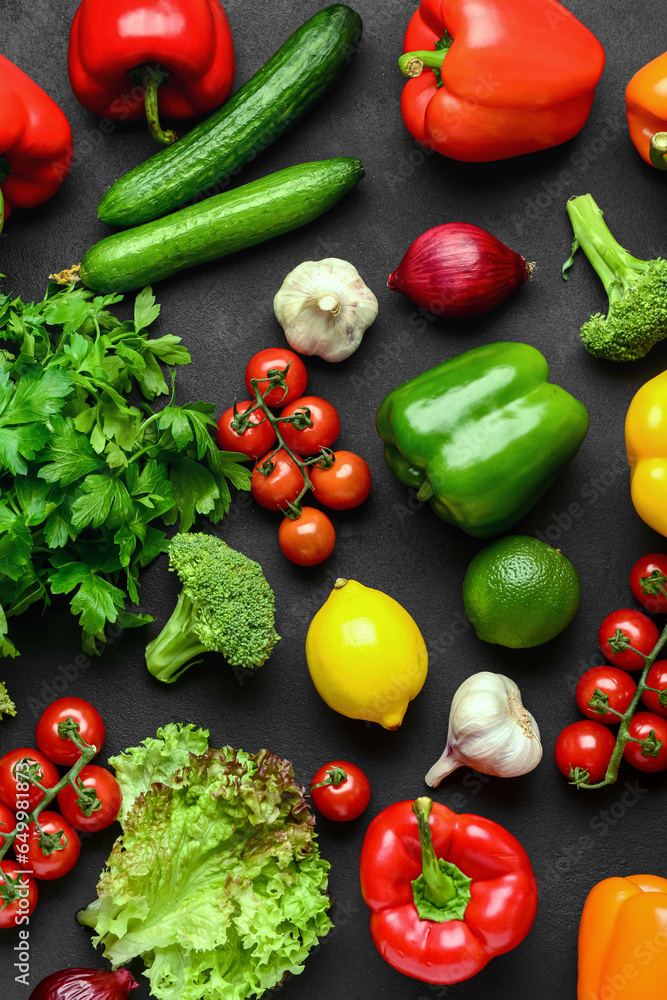Different fresh vegetables, lettuce and parsley on black background Different fresh vegetables, lettuce and parsley on black background